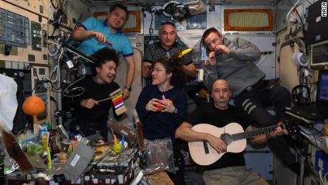 The crew formed a band to sing mission control centers around the world.