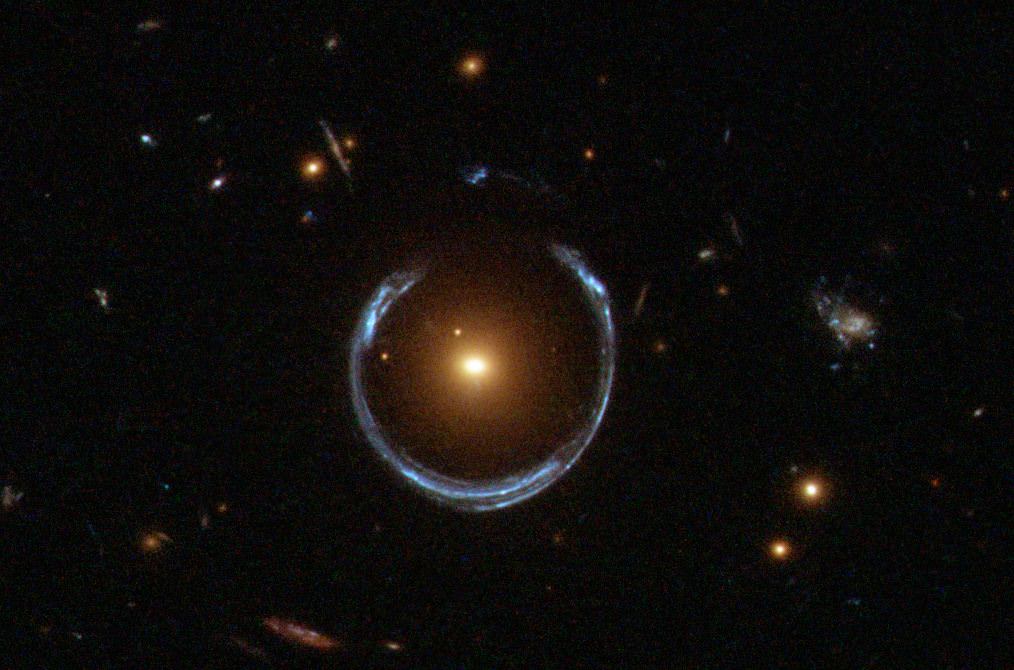 Another Einstein ring.  This one is called LRG 3-757.  This was detected by a Sloan Digital Sky survey, but this image was captured by Hubble's Wide Field Camera 3. Photo: NASA / Hubble / ESA